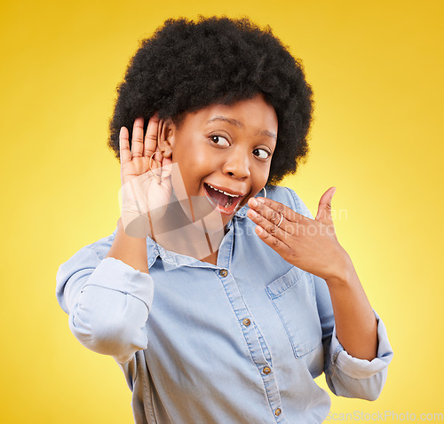 Image of Surprise, gossip and black woman listening in a studio with a wow, wtf or omg face expression. Secret, shock and curious African female model with an afro with a listen gesture by a yellow background