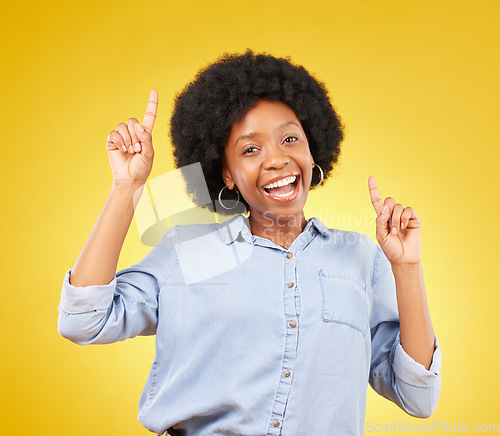 Image of Promotion, happy portrait or black woman point at mock up space, advertising mockup or marketing promo. Commercial girl, studio gesture and excited person with product placement on yellow background