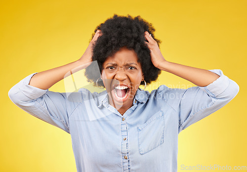Image of Crazy, face portrait and black woman scream, shout and yell from mental health crisis, angry rage or anger management problem. Afro, studio headshot and African person isolated on yellow background