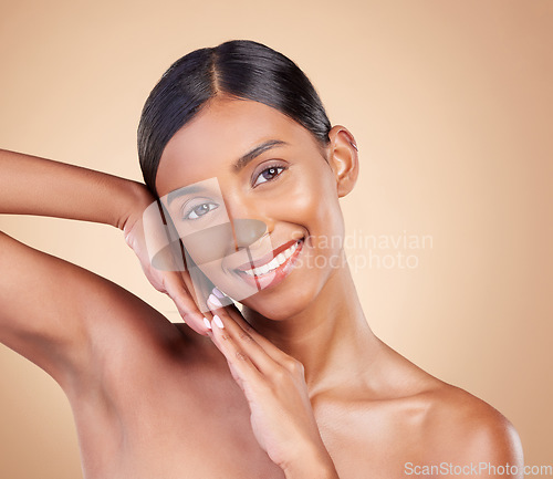 Image of Portrait, skincare and happy with a model woman in studio on a beige background for natural beauty. Face, smile and makeup with an attractive young female posing for cosmetics or luxury wellness