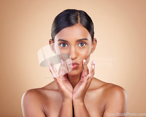 Image of Portrait, beauty and pout a model woman in studio on a beige background for natural skincare. Face, lips and kiss with an attractive young female posing for aesthetic, cosmetics or luxury wellness