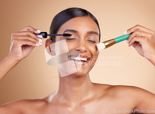 Image of Makeup brush, portrait or happy woman with beauty mascara, facial products or self care on studio background. Face smile or Indian girl model with cosmetics or natural glowing skincare headshot