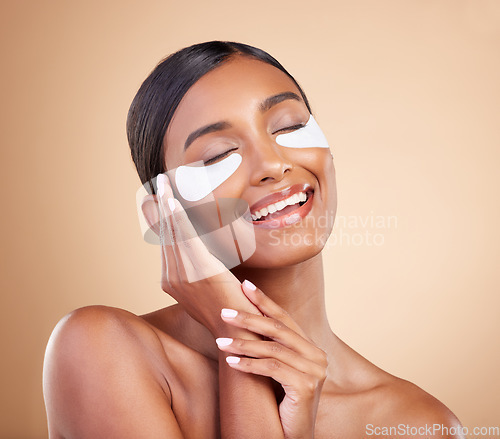 Image of Face, smile or happy woman with eye patch for beauty or skincare isolated on studio background. Cosmetics or girl model with facial collagen pads or dermatology product for anti aging or dark circles