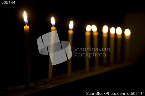 Image of Nine yellow candles