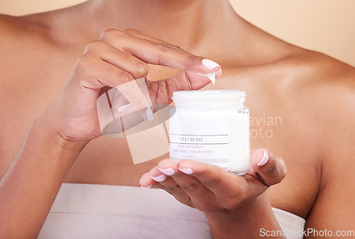 Image of Hands, skincare or woman with cream product for beauty or wellness isolated on studio background. Body cosmetics, self care zoom or girl with facial moisturizer or dermatology lotion for anti aging