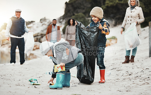 Image of Beach cleaning, plastic and children, family or volunteer group in education, learning and community service. Happy people and kids help with waste, garbage or trash in climate change or pollution