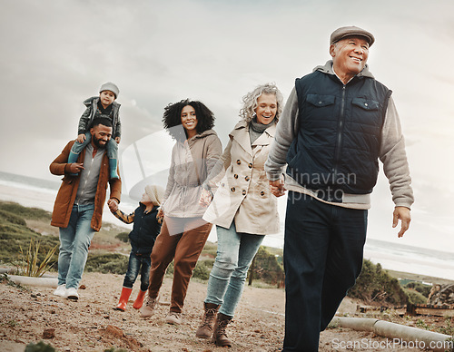 Image of Family holding hands, hiking outdoor together in nature and happiness, bonding and spending quality time. Grandparents, parents and children walking, love and care with happy people and generations