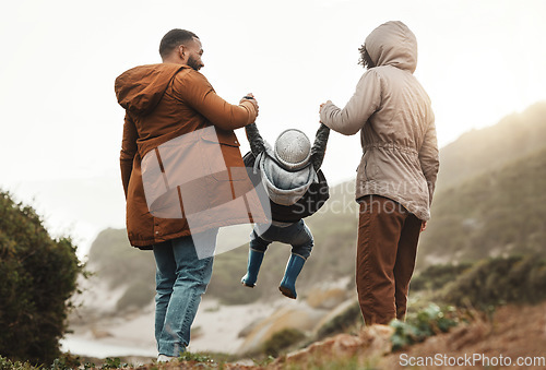 Image of Nature fitness, holding hands and hiking family of mother, father and child walking, play and bond on mountain adventure. Love, freedom peace or back view of winter people trekking on outdoor journey