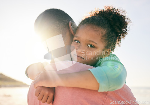 Image of Beach, black father and hug child with love, embrace and bond on outdoor vacation for peace, freedom and quality time. Sunshine flare, portrait and family youth kid, dad or people together in Jamaica