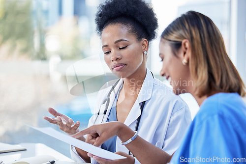 Image of Women, doctors and team planning paperwork, documents and test results in medical office. Healthcare management of black woman with notes, collaboration and discussion of hospital research analysis