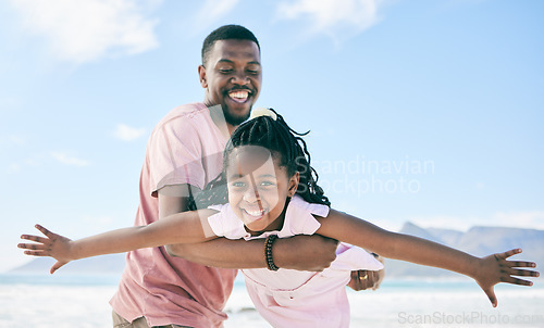 Image of Child, black man and airplane game on beach on playful family holiday in Australia with freedom and energy. Travel, fun and happy father and girl with smile playing and bonding together on vacation.