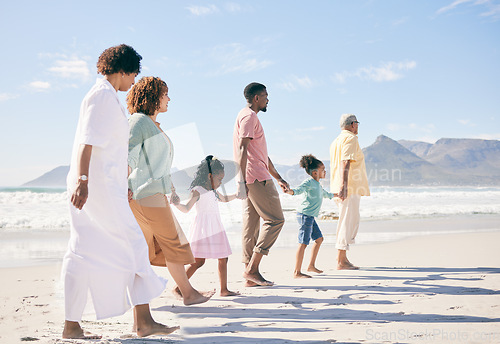 Image of Family is walking on beach, travel and holding hands with generations, unity and freedom with love, together outdoor. Grandparents, parents and children, people on holiday with tropical destination