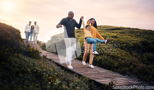 Image of Family, walking or sunset with parents, kids and grandparents playing together outdoor in nature. Spring, love or environment with children and senior relatives taking a walk while bonding