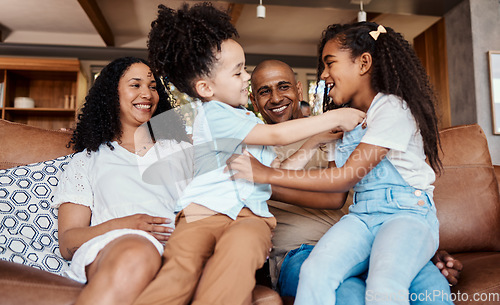 Image of Happy, tickle and relax with family on sofa for bonding, affectionate and laughing. Funny, free time and smile with parents and children playing in living room at home for care, weekend and games