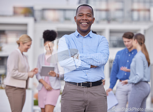 Image of Business people, leadership and portrait of black man outside office with smile and confidence on break from work. Manager, ceo and boss with employees networking and b2b with human resources team.