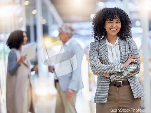 Image of Young business woman, portrait and arms crossed for empowerment, motivation and confident leader. Happy female employee standing in company for professional career, pride or happiness in busy office