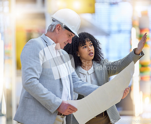 Image of Man, woman and construction team pointing at building site, blueprint ideas and discussion of design. Diversity, project management and architecture for infrastructure, engineering and floor planning