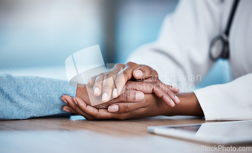 Image of Doctor and patient closeup, holding hands and consultation support, healthcare services and sad news, test results or help. Clinic, medical professional or black people consulting, helping and advice