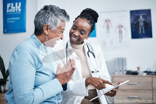 Image of Black woman, doctor and elderly patient with good news, tablet and results for health, advice and report. Happy african medic, mobile touchscreen or healthcare with smile, tech or support in hospital