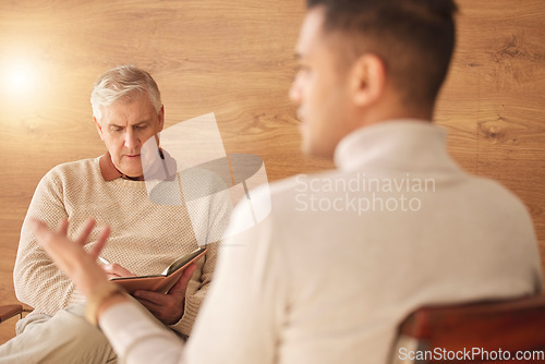 Image of Psychologist, counseling or man consulting in therapy, mental healthcare or support in consultation. Back view of patient talking to writing or listening senior therapist for medical help or advice
