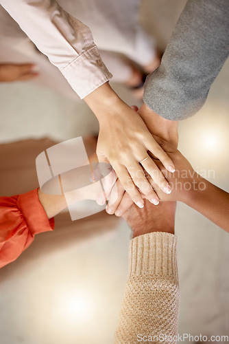 Image of Team building, top view or hands in meeting together on a business or group project for motivation. Diversity, mission or employees in collaboration for our vision, strategy planning or target goals