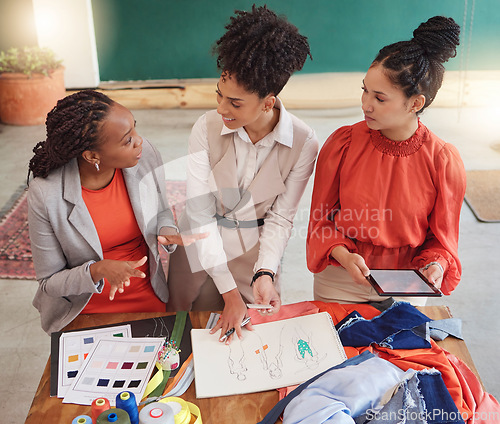 Image of Tablet, fashion or women in meeting planning clothing, fabrics or boutique clothes with teamwork together. Creative designers talking or working on group ideas, sketch or digital strategy in office