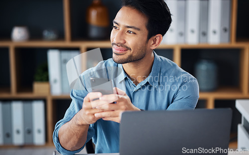 Image of Business, thinking and Asian man in office, smartphone and decision for opportunity, happiness or success. Japan, male employee or entrepreneur with cellphone, laptop or connection with search online