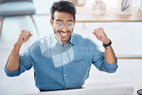 Image of Success, yes and happy businessman in office, celebrating and excited for email, review or loan approval. Hands, celebration and corporate male online winner with emoji, wow or winning gesture