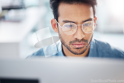 Image of Serious, computer and business man in office for idea research, contemplating and planning. Website, technology and digital with male employee reading online for proposal, project and email news