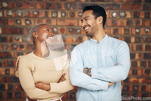 Image of Teamwork, arms crossed and business people laughing in office workplace at funny joke or comedy. Collaboration, comic diversity and happy man and black woman together for team building and confidence