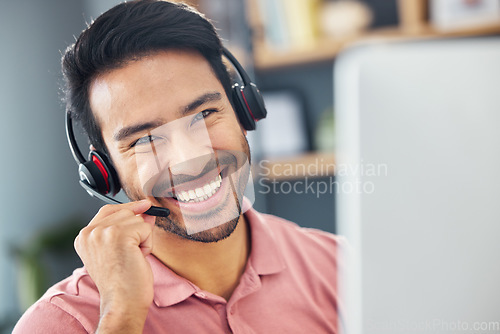 Image of Smile, consulting and portrait of an Asian man in a call center for online communication. Happy, contact us and a customer service agent working in telemarketing, talking and working in support