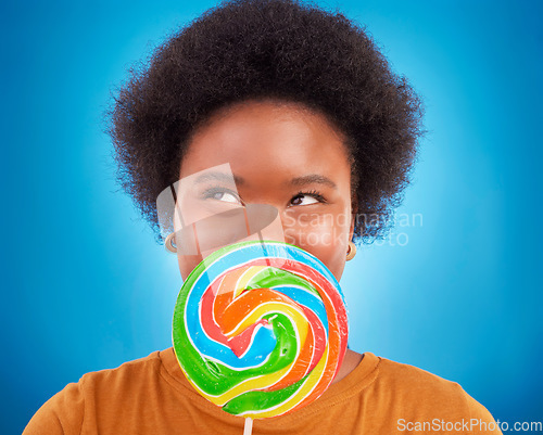 Image of Sweet, happiness and black woman with lollipop, excited and lady on blue studio background. African American female, candy and girl with dessert, happy and cheerful with joy, treat and confectionary