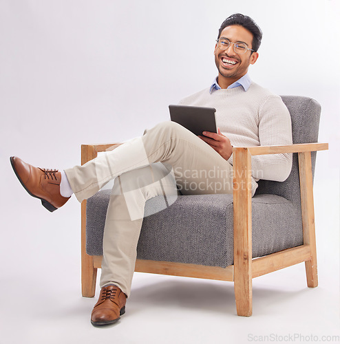 Image of Business man on armchair isolated on a white background happy therapist portrait, career mindset and work on tablet. Asian professional person or psychologist relax on chair, digital tech and studio