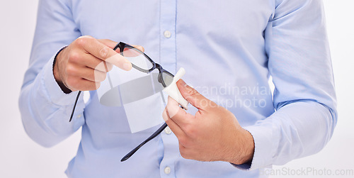 Image of Hands, wipe glasses and cleaning in studio with man, eye health and fashion by white background. Businessman, spectacles and cloth for clean glass, vision and eyesight with frame for eyes by backdrop