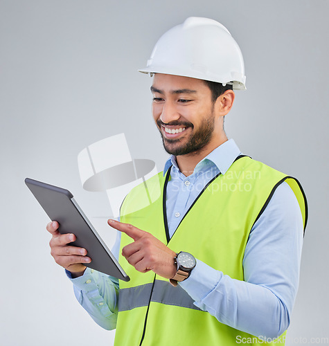 Image of Construction worker, engineer and happy man in studio with tablet and helmet safety on white background. Smile, internet and contractor or architect in online planning for project management in India