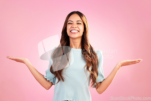 Image of Happy woman, marketing and smile with hands out, branding and product placement with promo on pink background. Advertising, logo and brand, mockup space and excited female, show or display in studio