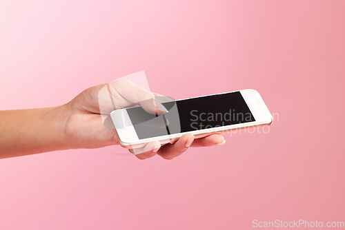 Image of Hands, phone mockup and screen in studio isolated on a pink background. Cellphone, social media and woman with mobile smartphone for branding, advertising or marketing for product placement space.