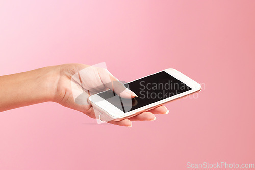 Image of Phone mockup, hands and screen in studio isolated on a pink background. Cellphone, social media and woman with mobile smartphone for branding, advertising or marketing for product placement space.