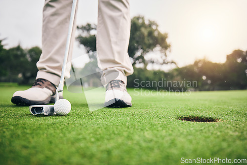 Image of Golf, hole and player hit ball and professional athlete training and putting on a filed as exercise or workout. Sportsman, equipment and gentleman golfer or person relax and playing a sport