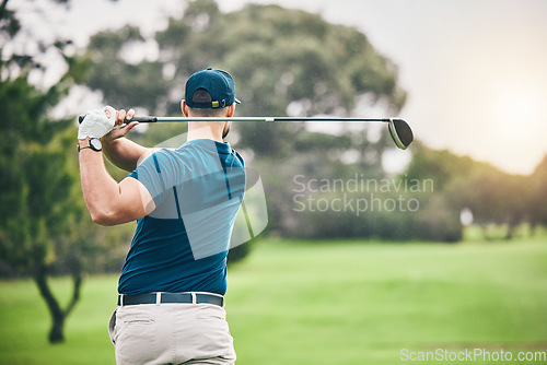 Image of Sports, golf and man swing driver on field for exercise, training or workout match. Fitness, golfing course and male golfer swinging club for practice, competition or game for recreation outdoors.