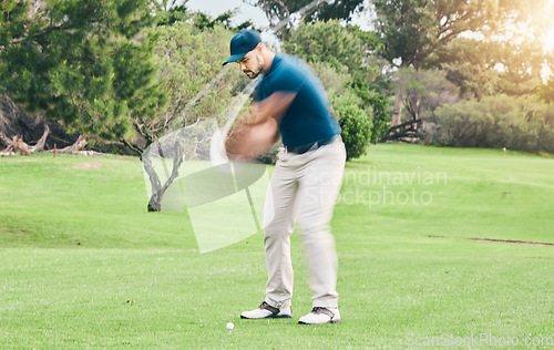 Image of Golf, stroke and motion blur with a sports man swinging a club on a field or course for recreation and fun. Golfing, grass and training with a male golfer playing a game on a green during summer