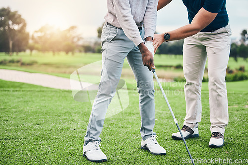 Image of Golf lesson, sports teaching and coach hands helping a man with swing and stroke outdoor. Lens flare, green course and club support of a athlete ready for exercise, fitness and training for a game