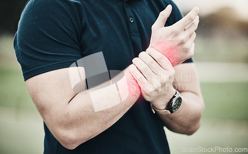 Image of Sport, injury and golf, man with wrist pain during game on course, massage and outdoor relief in health and wellness. Green, hands on arm in support and golfer with ache from swing in golfing workout