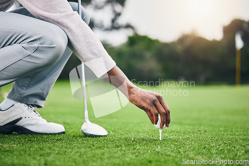 Image of Ready, golf ball and tee with hand of black man on field for training, tournament and challenge. Start, competition match and sports with athlete and club on course for action, games and hobby