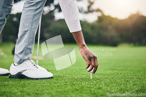 Image of Hobby, golf ball and tee with hand of black man on field for training, tournament and challenge. Start, competition match and ready with athlete and club on course for action, games and sports