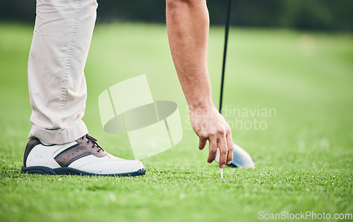 Image of Sports, golf ball and tee with hand of man on course for training, tournament and challenge. Start, competition match and ready with athlete and club on grass field for action, games and hobby