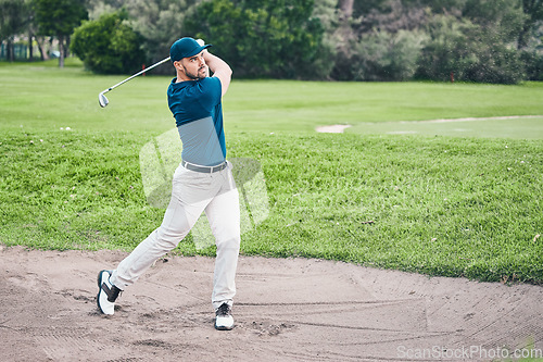 Image of Golf stroke, sport and golfer outdoor for game, fitness and exercise on grass with a swing. Athlete, training and man at a sports club for cardio and workout on a green course with focus and action