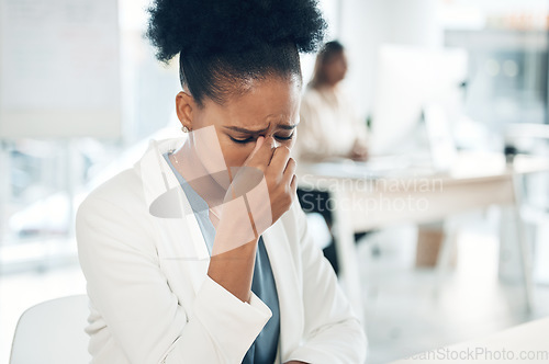 Image of Black woman, business and stress or depressed in office with a headache and bad mental health. African female entrepreneur burnout, anxiety and frustrated or sad at desk with problem or crisis