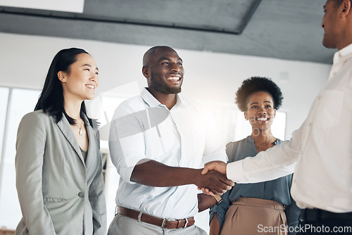 Image of B2b, black man or manager shaking hands in meeting or startup project partnership or business deal. Teamwork, office handshake or happy worker talking or speaking of success or hiring agreement