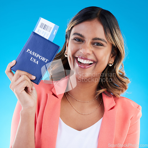 Image of Passport, excited and woman portrait isolated on blue background for USA travel opportunity, immigration or holiday. Identity documents, flight ticket and happy face of young indian person in studio